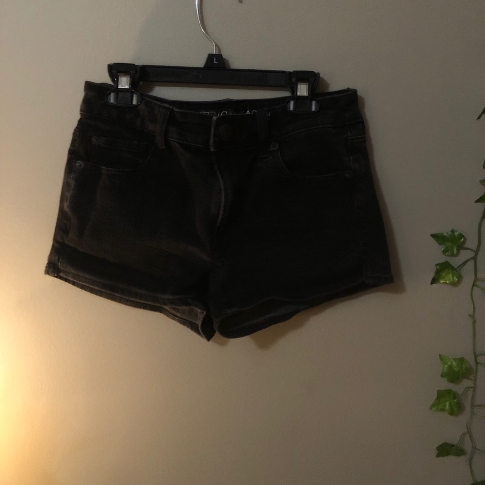 black jean shorts.